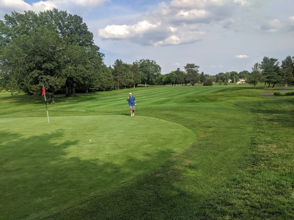 Panoramic view of a lush green golf course at Herndon Centennial Golf Course. Smooth