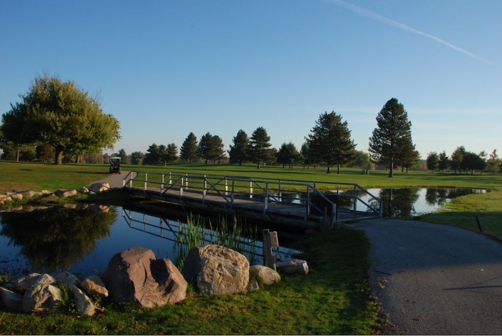 Panoramic view of a lush green golf course at Heron Creek Golf Club. Smooth