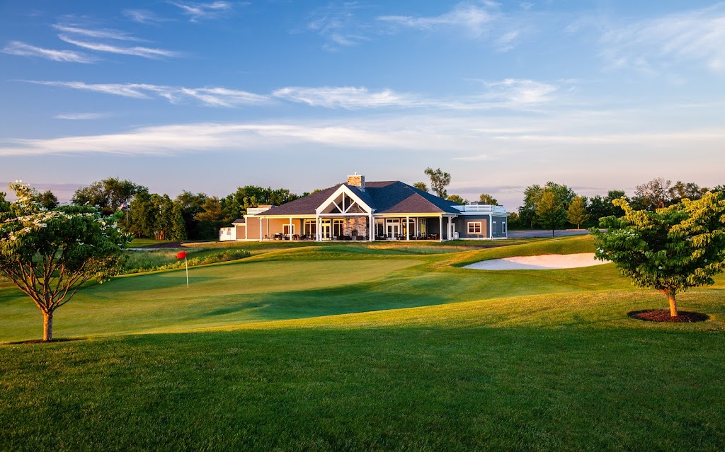 Panoramic view of a lush green golf course at Heron Glen Golf Course. Smooth