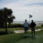 green grass with the flag in the hole.
