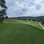 green grass with the flag in the hole.