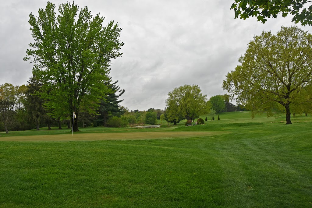 Panoramic view of a lush green golf course at Hiawatha Golf Club. Smooth
