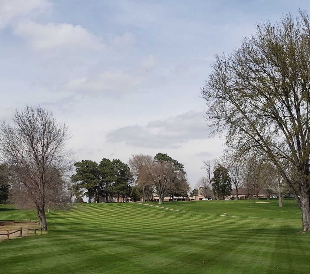 Panoramic view of a lush green golf course at Hiawatha Golf Club. Smooth