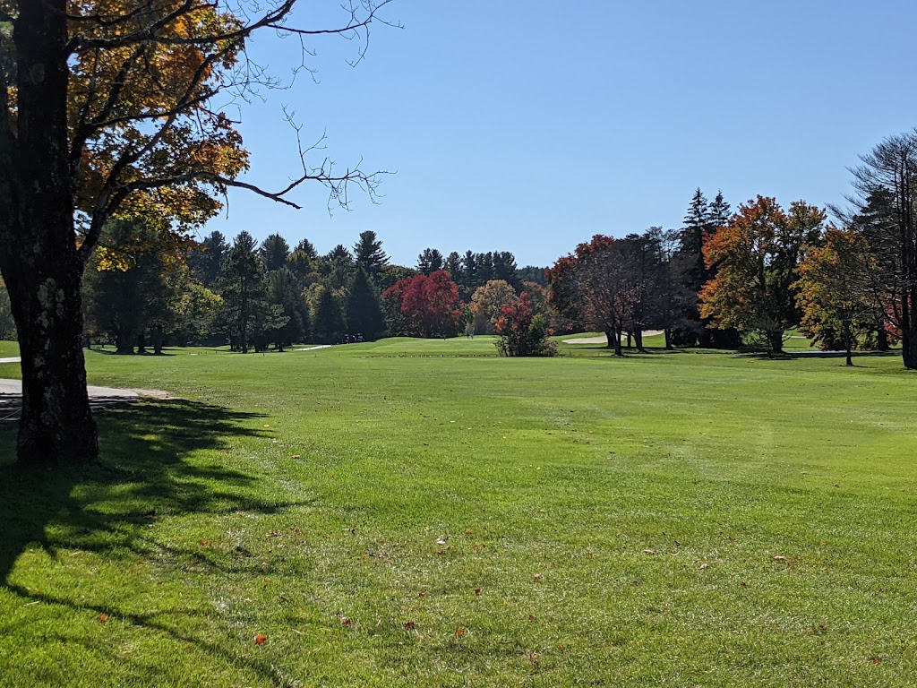 Panoramic view of a lush green golf course at Hickory Hill Golf Course. Smooth
