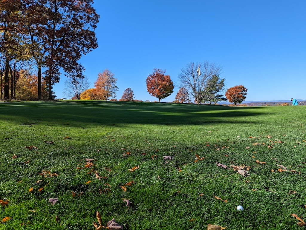 Panoramic view of a lush green golf course at Hickory Hill Golf Course. Smooth