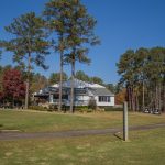 Panoramic view of a lush green golf course at Hickory Knob Golf Course. Smooth