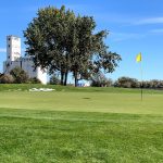 Panoramic view of a lush green golf course at Hickory Swing Golf Course. Smooth