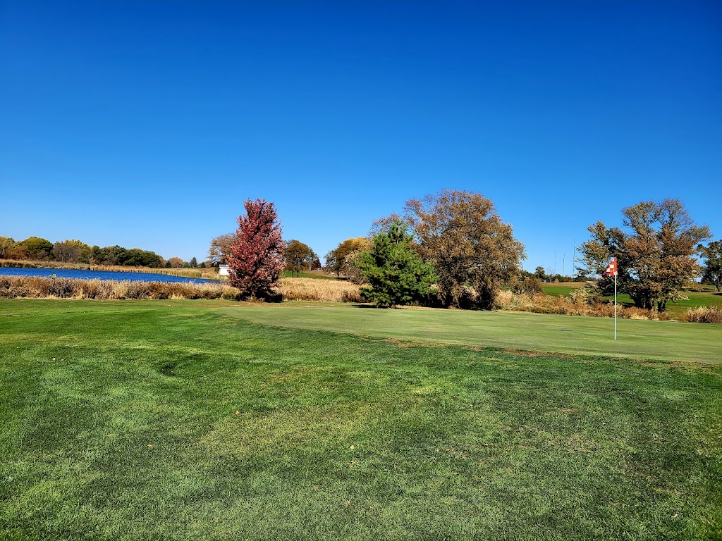 Panoramic view of a lush green golf course at Hidden Acres Golf Club. Smooth