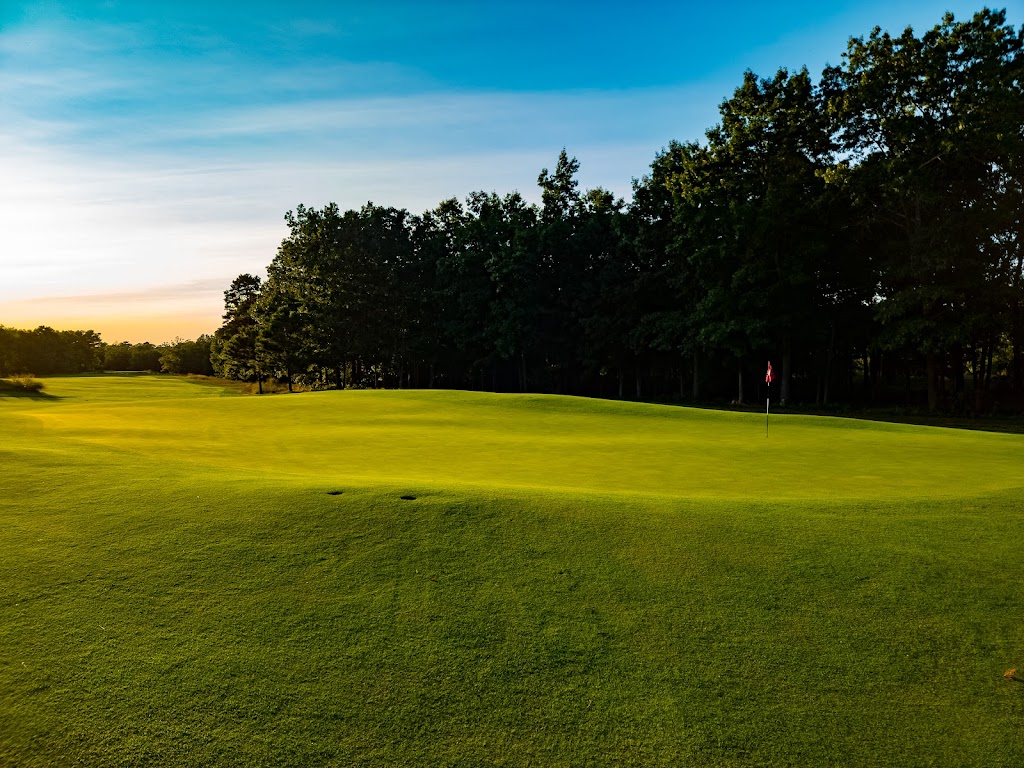 Panoramic view of a lush green golf course at Hidden Creek Golf Club. Smooth