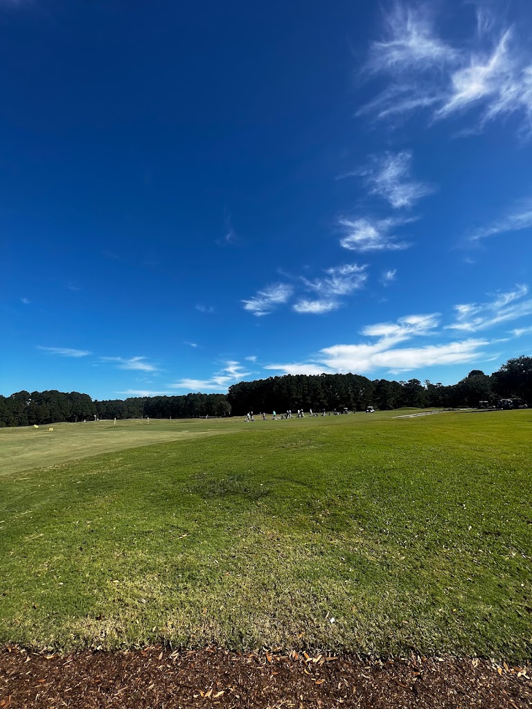 Panoramic view of a lush green golf course at Hidden Cypress Golf Club. Smooth
