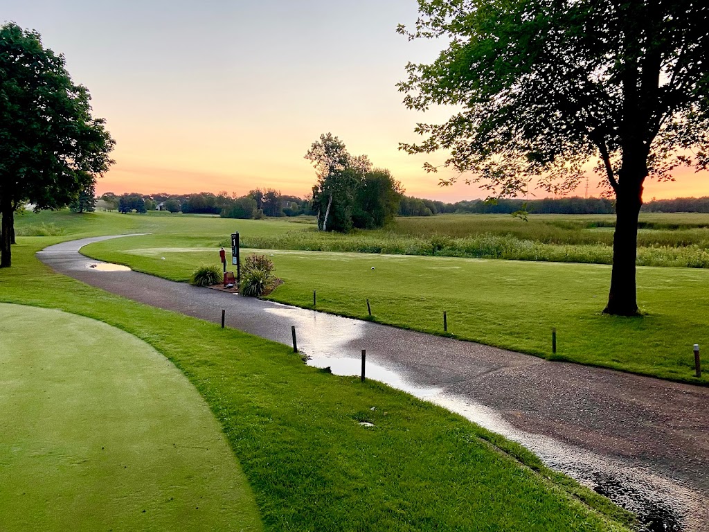 Panoramic view of a lush green golf course at Hidden Haven Golf Club. Smooth