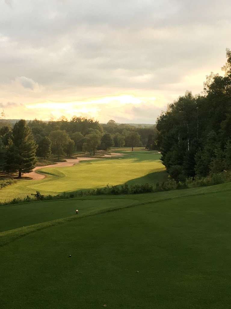Panoramic view of a lush green golf course at Hidden River Golf & Casting Club. Smooth