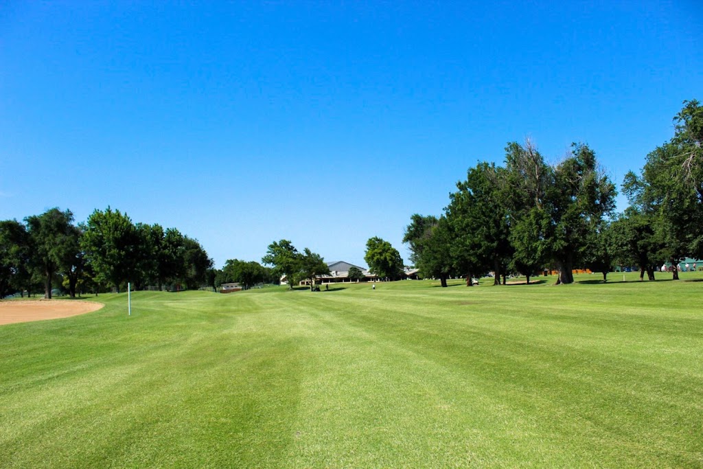 Panoramic view of a lush green golf course at Hidden Trails Golf & Country Club. Smooth