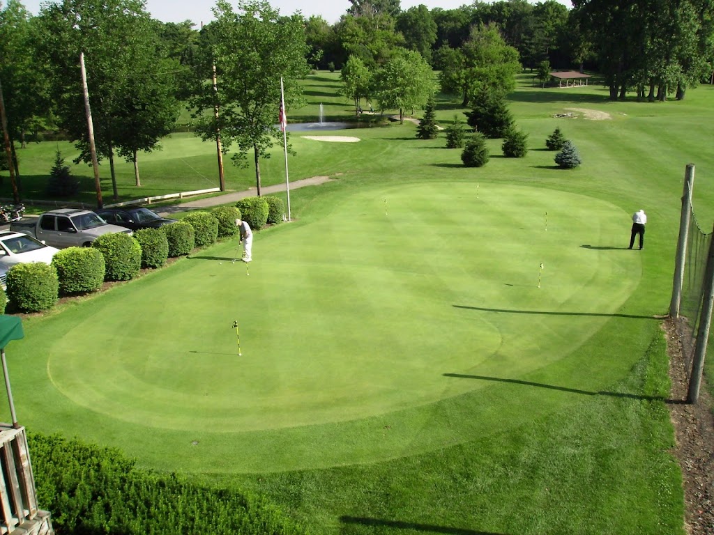 Panoramic view of a lush green golf course at Hidden Valley Golf Course. Smooth
