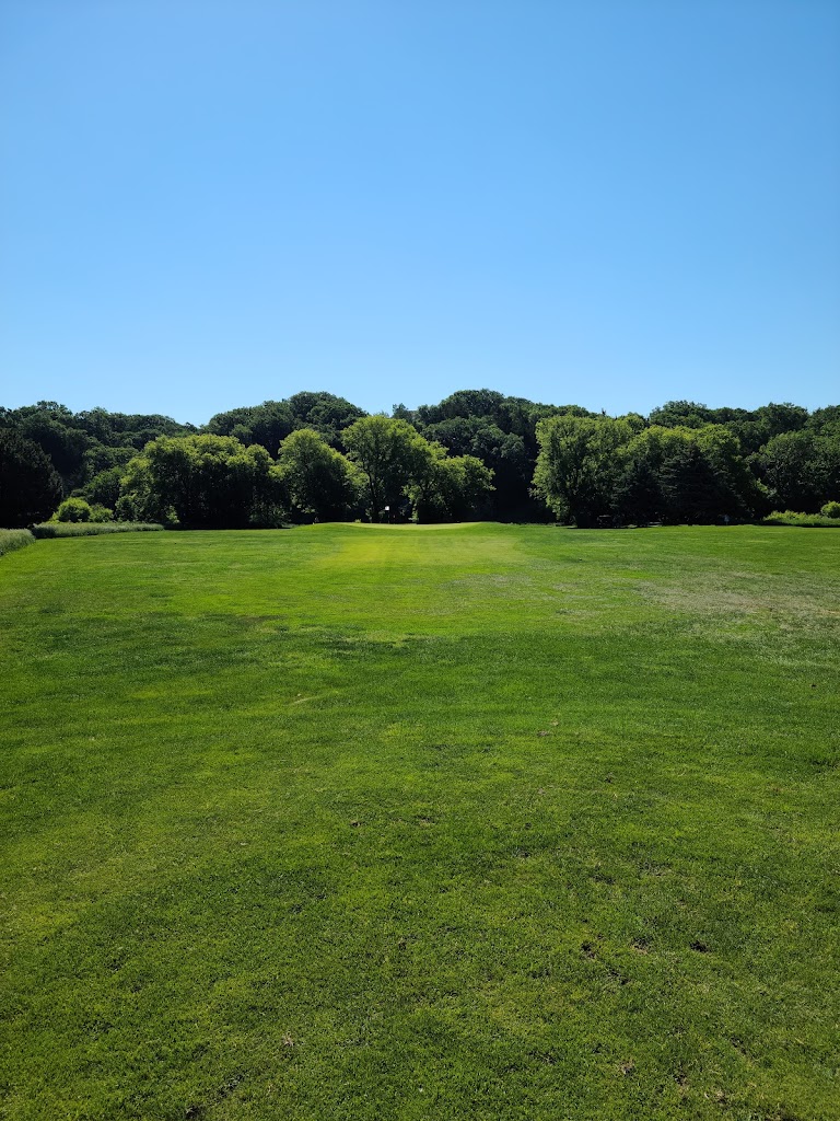 Panoramic view of a lush green golf course at Hidden Valley Golf Course. Smooth