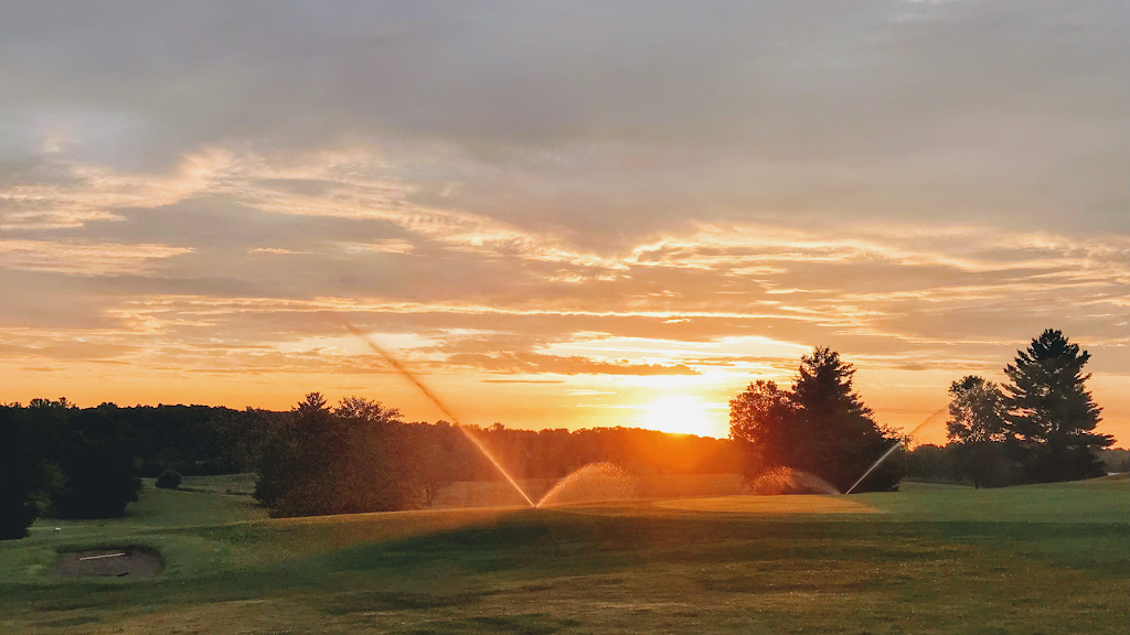 Panoramic view of a lush green golf course at Hidden Valley Golf Course. Smooth