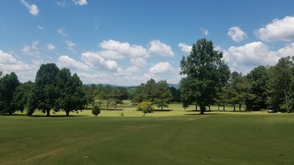 Panoramic view of a lush green golf course at Hidden Valley Golf. Smooth