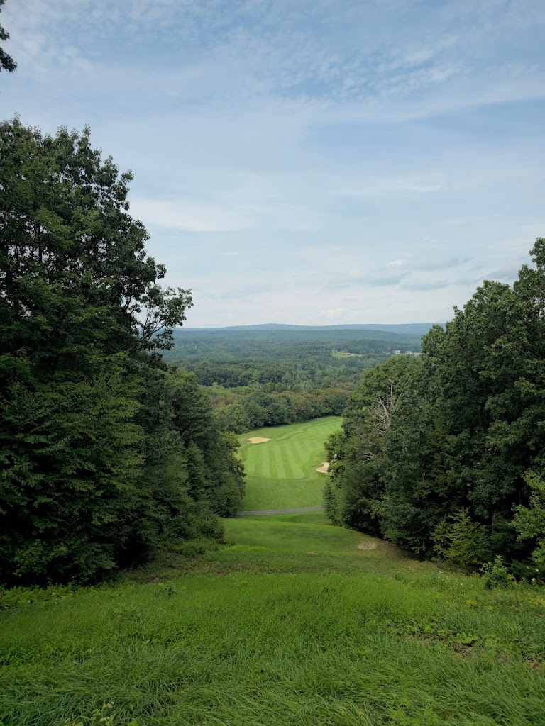 Panoramic view of a lush green golf course at Hideaway Hills Golf Club. Smooth