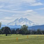 Panoramic view of a lush green golf course at High Cedars Golf Club. Smooth