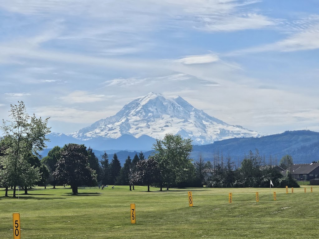 Panoramic view of a lush green golf course at High Cedars Golf Club. Smooth