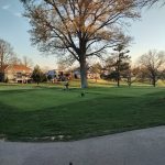 Panoramic view of a lush green golf course at Highland Country Club. Smooth