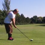 green grass with the flag in the hole.