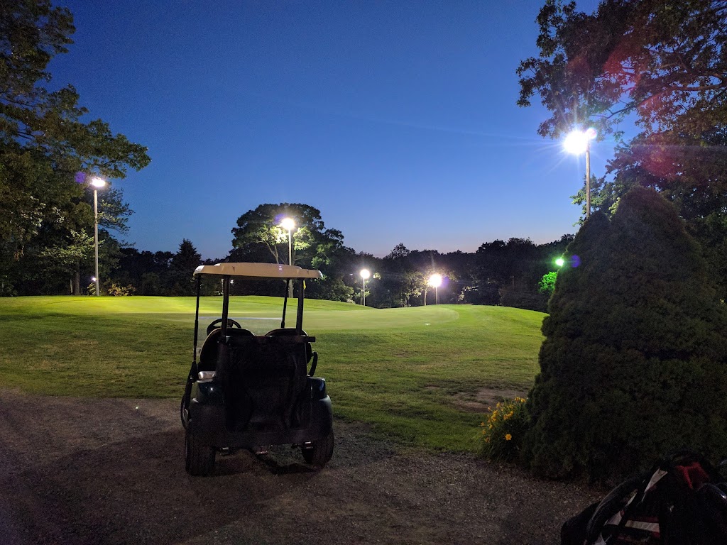 Panoramic view of a lush green golf course at Highland Greens Golf Course. Smooth