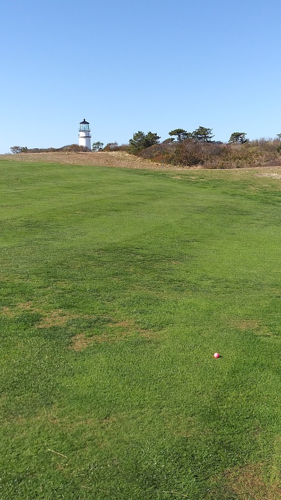 Panoramic view of a lush green golf course at Highland Links. Smooth