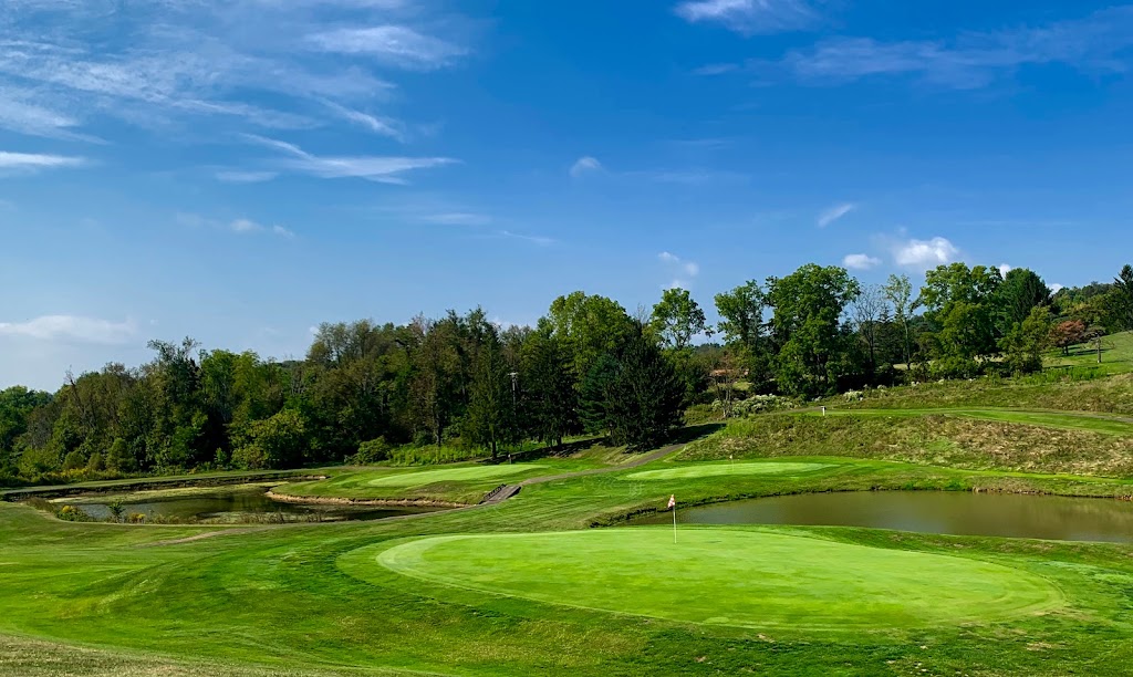 Panoramic view of a lush green golf course at Highland Springs Golf Course Llc. Smooth