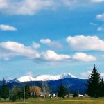Panoramic view of a lush green golf course at Highland View Golf Course. Smooth