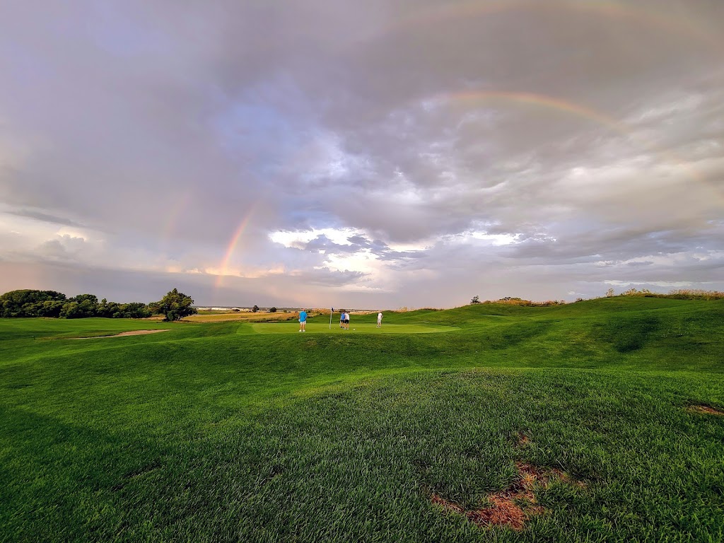 Panoramic view of a lush green golf course at Highlands Golf Course. Smooth