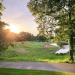 Panoramic view of a lush green golf course at Highlands Golf and Pub. Smooth