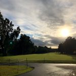 Panoramic view of a lush green golf course at Hilo Municipal Golf Course. Smooth