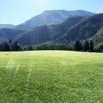 Panoramic view of a lush green golf course at Hobble Creek Golf Course. Smooth