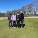 Panoramic view of a lush green golf course at Hodge Park Golf Course. Smooth
