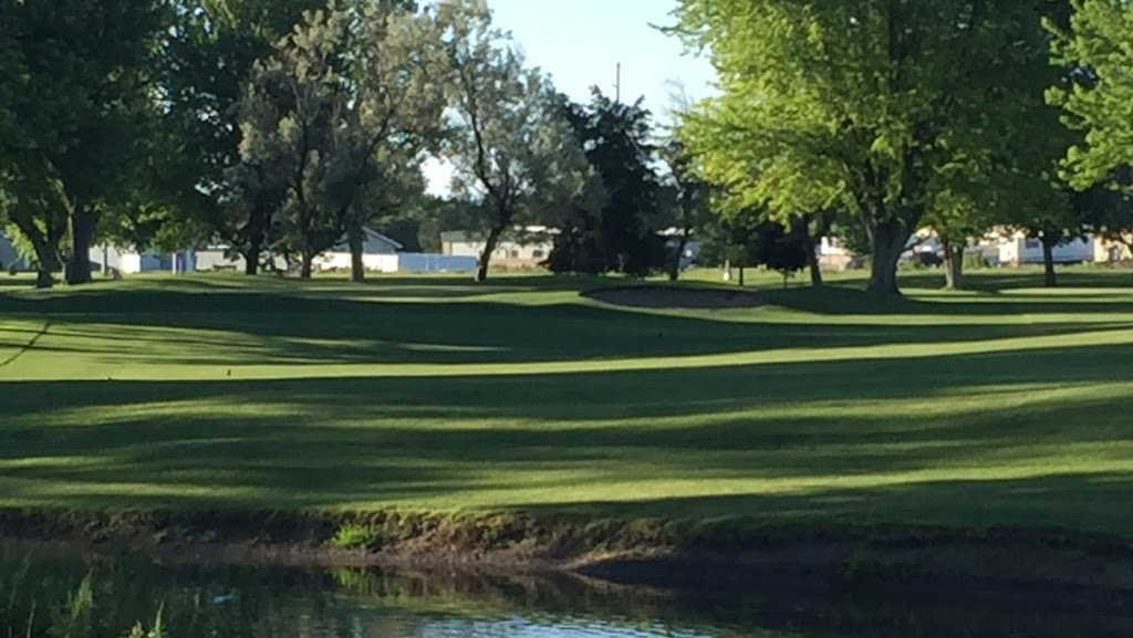 Panoramic view of a lush green golf course at Holdrege Country Club. Smooth