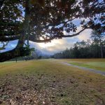 Panoramic view of a lush green golf course at Holly Hills Municipal Golf Course. Smooth