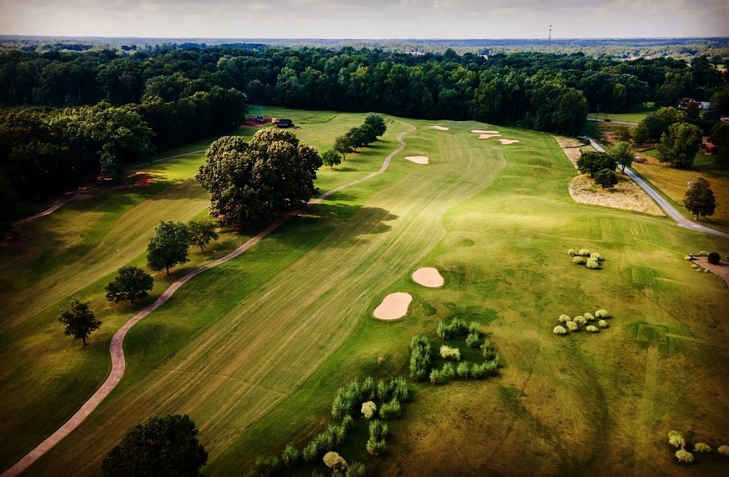 Panoramic view of a lush green golf course at Holly Ridge Golf Links. Smooth
