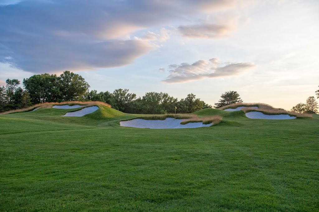 Panoramic view of a lush green golf course at Hollywood Golf Club. Smooth