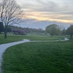 Panoramic view of a lush green golf course at Holmes Lake Park Golf Course. Smooth
