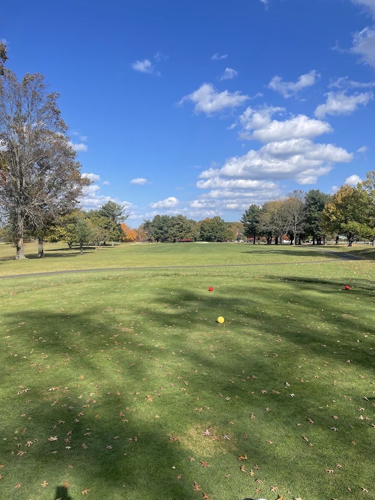 Panoramic view of a lush green golf course at Hominy Hill Golf Course. Smooth