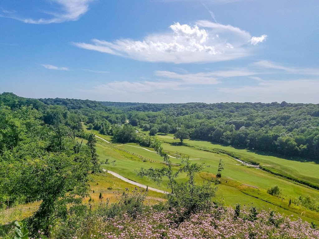 Panoramic view of a lush green golf course at Honey Creek Golf Club. Smooth