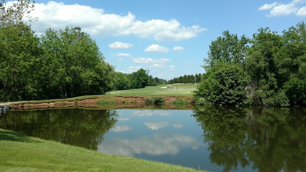 Panoramic view of a lush green golf course at Honey Run Golf Club. Smooth
