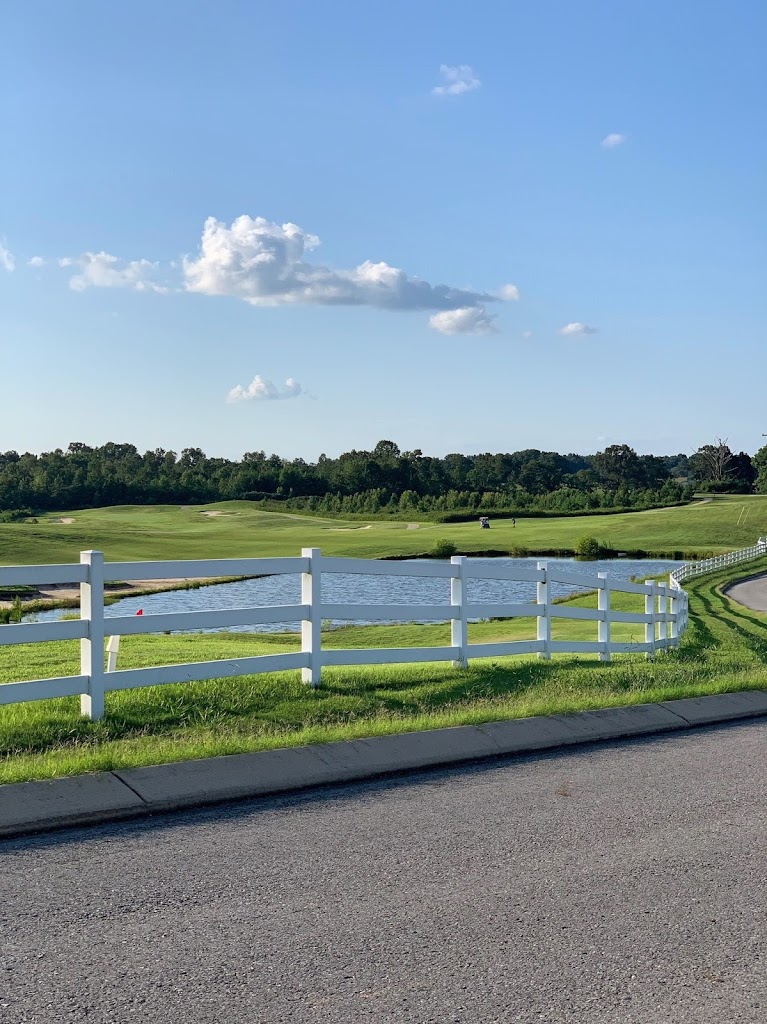 Panoramic view of a lush green golf course at Honky Tonk National Golf. Smooth
