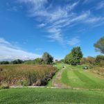 Panoramic view of a lush green golf course at Horicon Hills Golf Club. Smooth