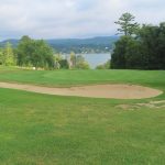 green grass with the flag in the hole.