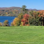 Panoramic view of a lush green golf course at Hotchkiss School Golf Course. Smooth