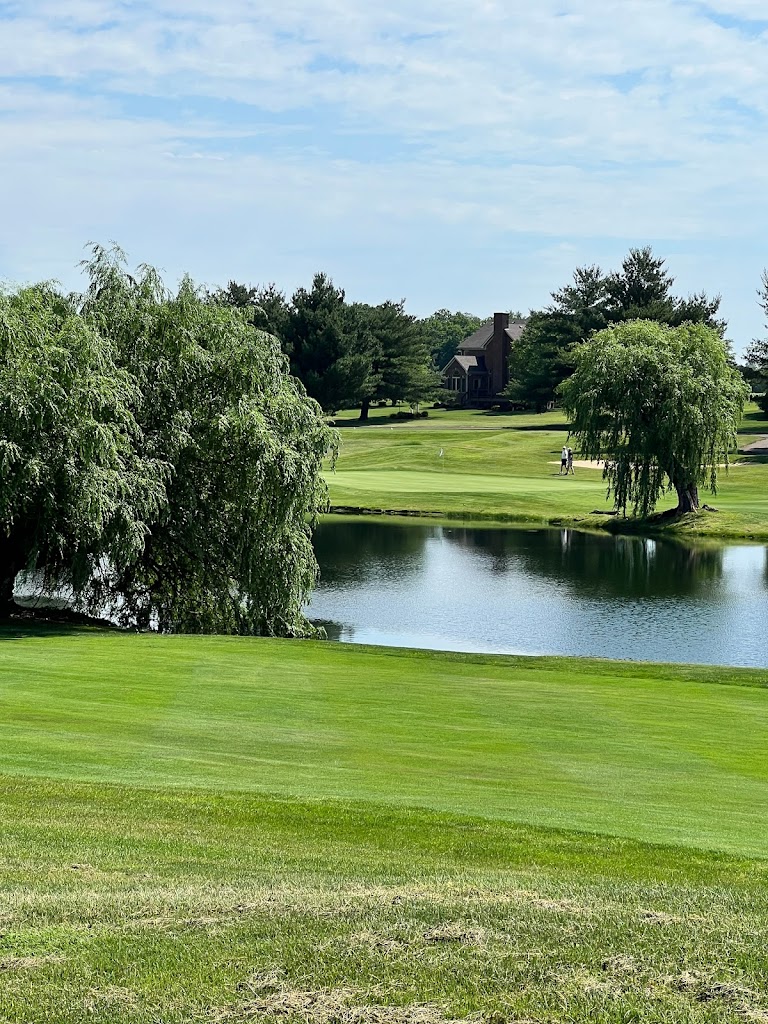 Panoramic view of a lush green golf course at Houston Oaks Golf Course. Smooth