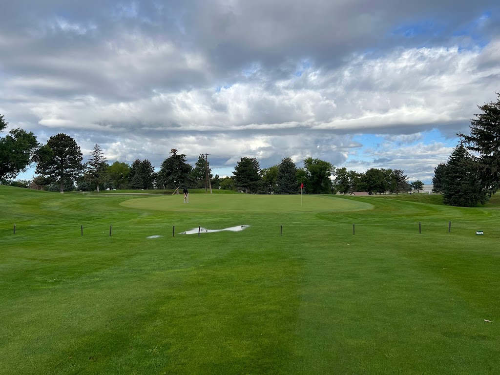 Panoramic view of a lush green golf course at Hubbard Golf Course. Smooth