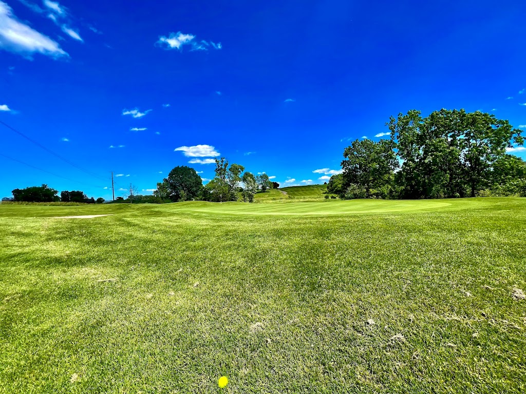 Panoramic view of a lush green golf course at Hunters Ridge Golf Course. Smooth